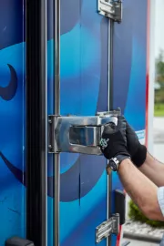 Driver opening a refrigerated truck